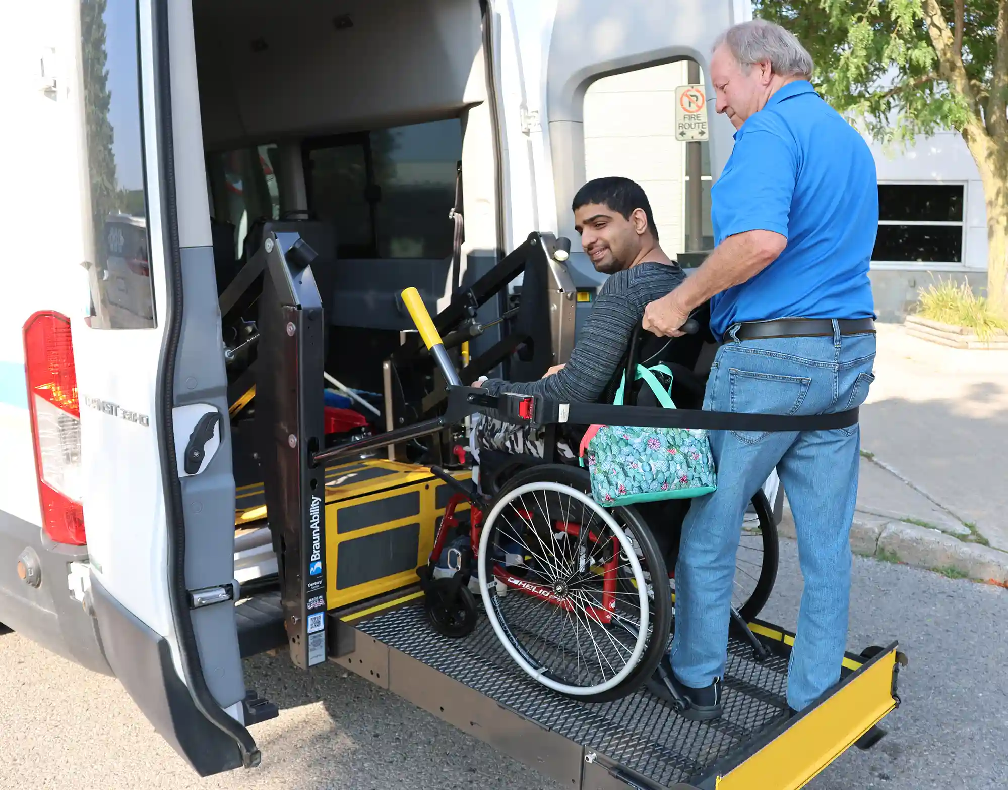 Senior entering assisted transport vehicle